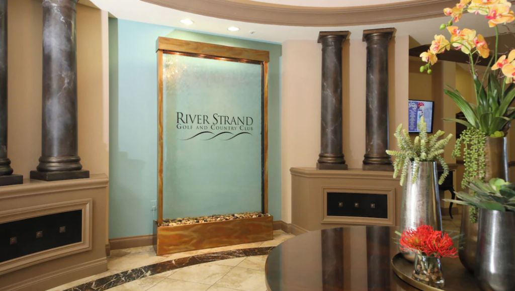 river-strand-amenities-lobby-waterwall
